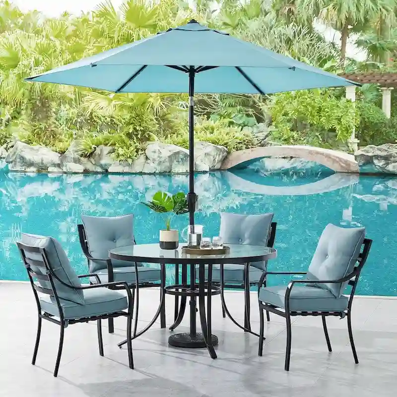 c5d13bb8bf770d6321f6e376cec5b6c430dbfeb609873ba859317f0a6a29f049 Hanover Lavallette 5-Piece Dining Set in Ocean Blue with 4 Stationary Chairs, 52-In. Round Glass-Top Table, Umbrella, and Base