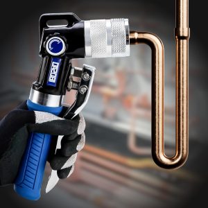 Hydraulic tube expanding tool kit, used to expand 3/8-inch copper tubes to 1-1/8 inches.