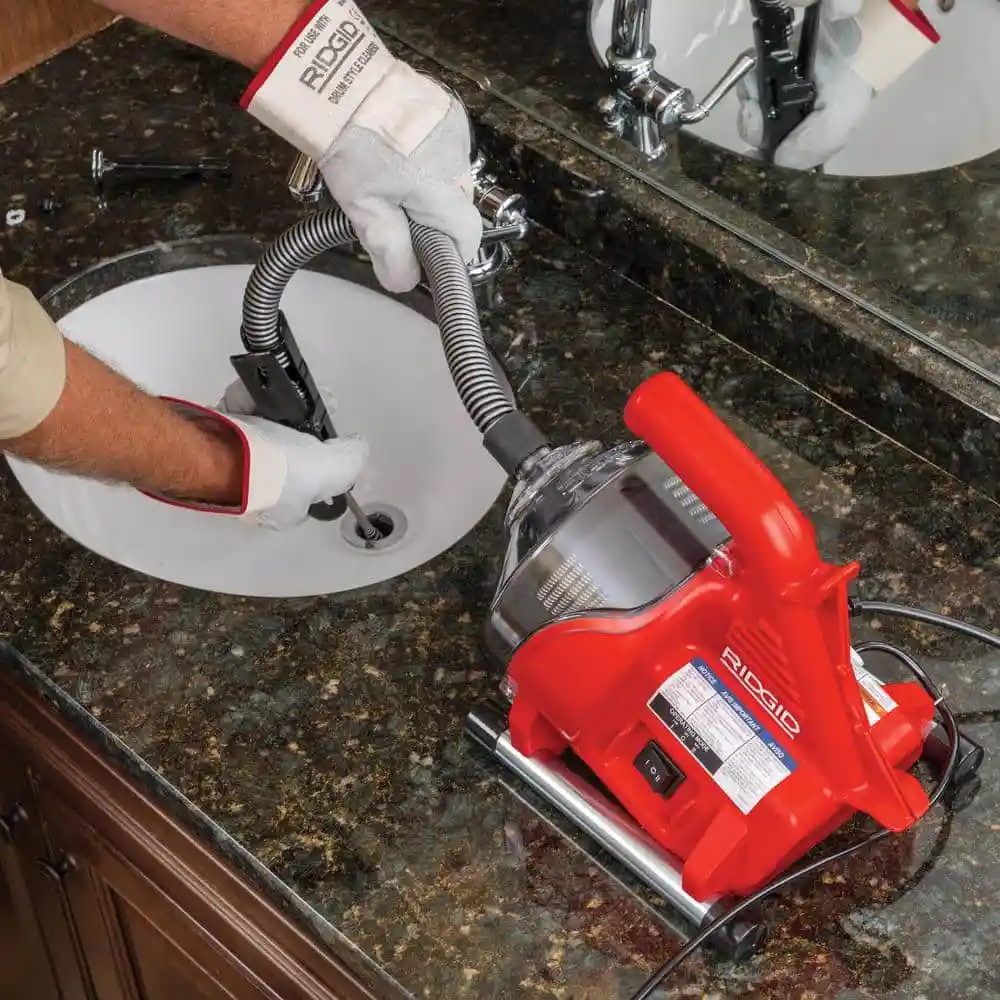 fe7fb2a9acda8a2905f5eff96e6f240799c1e99a355cb763d02060b8008e72d0 RIDGID PowerClear 120-Volt Drain Cleaning Snake Auger Machine for Heavy Duty Pipe Cleaning for Tubs, Showers, and Sinks 55808